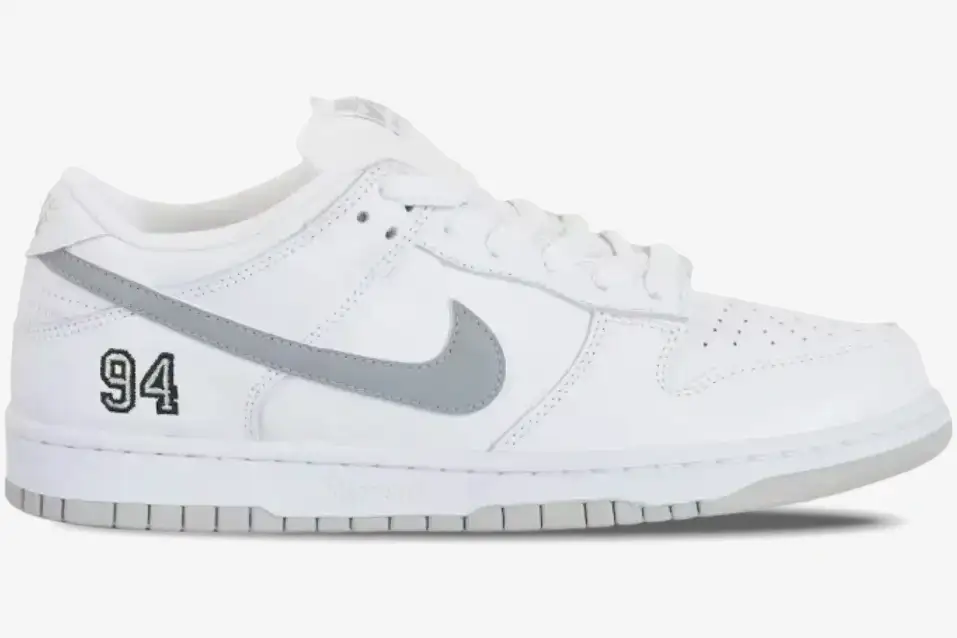 nike-sb-dunk-low-supreme-white-grey-side-view-hq8487100-img2525 Nike SB Dunk Low x Supreme White Grey Limited Edition sneaker, side profile view with '94' embroidery. - SKU HQ8487100