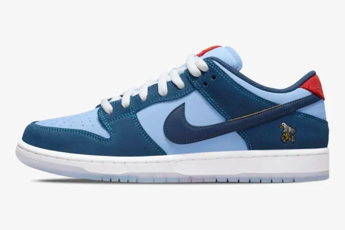Nike SB Dunk Low Why So Sad? sneaker in blue and navy suede, side profile view with bird embroidery. - SKU DX5549-400