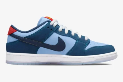 Side profile of Nike SB Dunk Low x Why So Sad? The Predatory Bird in light and navy blue. - SKU DX5549-400