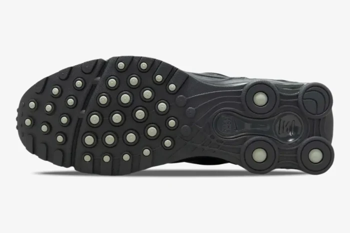Outsole view of Nike Shox Ride 2 in Anthracite Iron Grey showing circular tread and heel pillars. - SKU HV2540-001