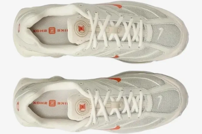 Top-down view of Nike Shox Ride 2 sneakers in Cream Orange with mesh uppers and orange accents. - SKU DJ5415-100