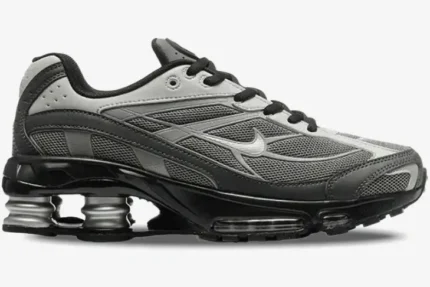 Nike Shox Ride 2 sneakers in Light Graphite and Black, shown from a side profile view. - SKU IB4470-099