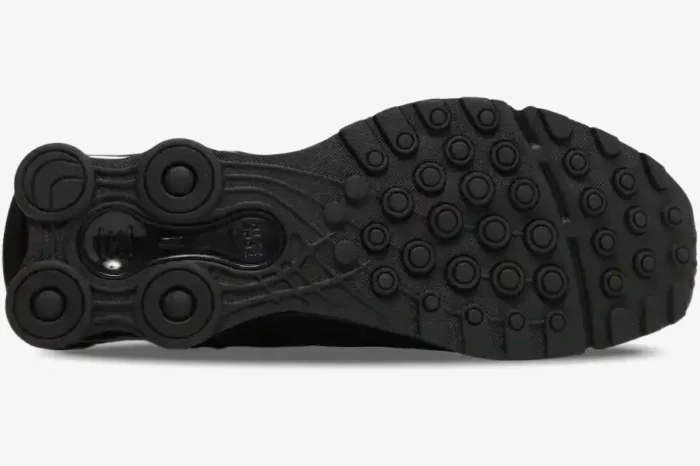 Bottom view of the black Nike Shox Ride 2 x Supreme outsole showing circular traction and heel pillars. - SKU DN1615-001