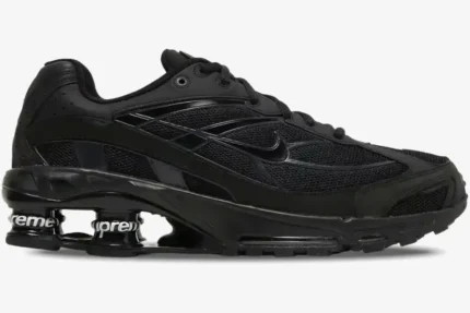 Side profile of the Nike Shox Ride 2 x Supreme black limited edition sneaker with branded cushioning pillars. - SKU DN1615-001