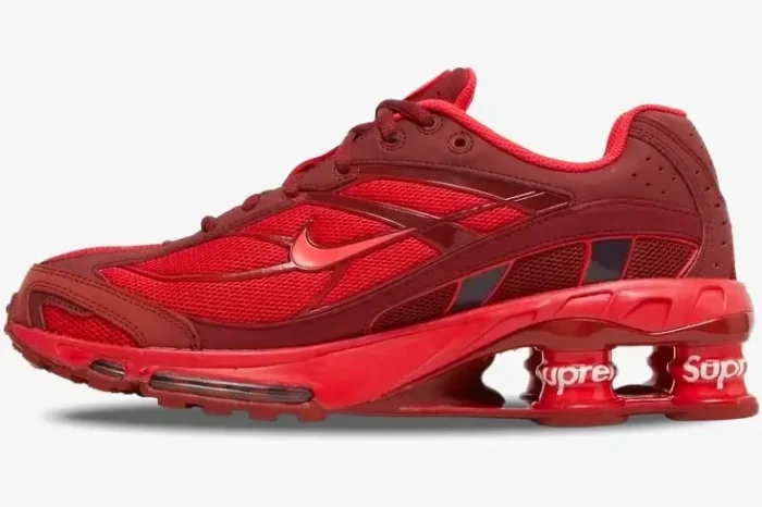Side profile of the Nike Shox Ride 2 x Supreme sneaker in a bold red colorway. - SKU DN1615-600