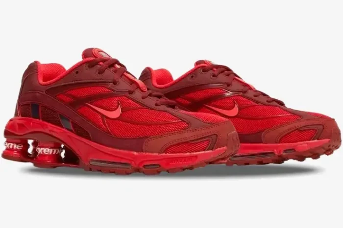 Side view of Nike Shox Ride 2 x Supreme Red sneakers with red mesh and branded Shox pillars. - SKU DN1615-600