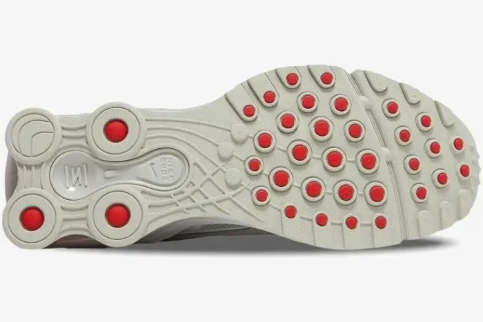 Bottom outsole view of Nike Shox Ride 2 x Supreme White Red sneakers with red circular traction pods. - SKU DN1615-100