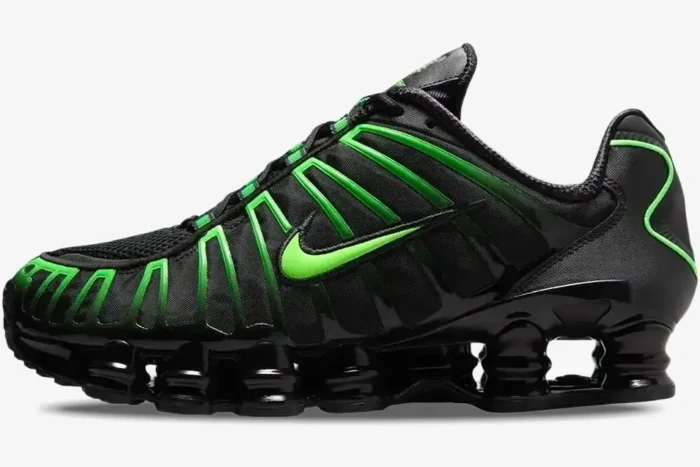 Side profile of Nike Shox TL sneakers in black with vibrant green strike accents and full-length Shox columns. - SKU AV3595-012