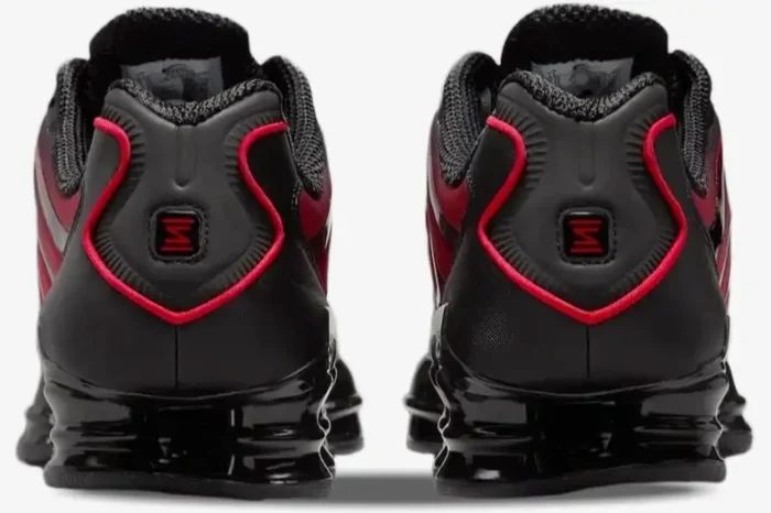 Rear view of Nike Shox TL sneakers in black and university red gradient with visible heel columns. - SKU IF6202-001