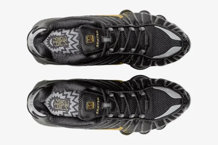 Top-down view of black and gold Nike Shox TL x Neymar Jr. sneakers. - SKU BV1388-001