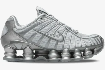 Side view of Nike Shox TL Pure Platinum Chrome sneakers in metallic silver with full-length Shox columns. - SKU AV3595-003