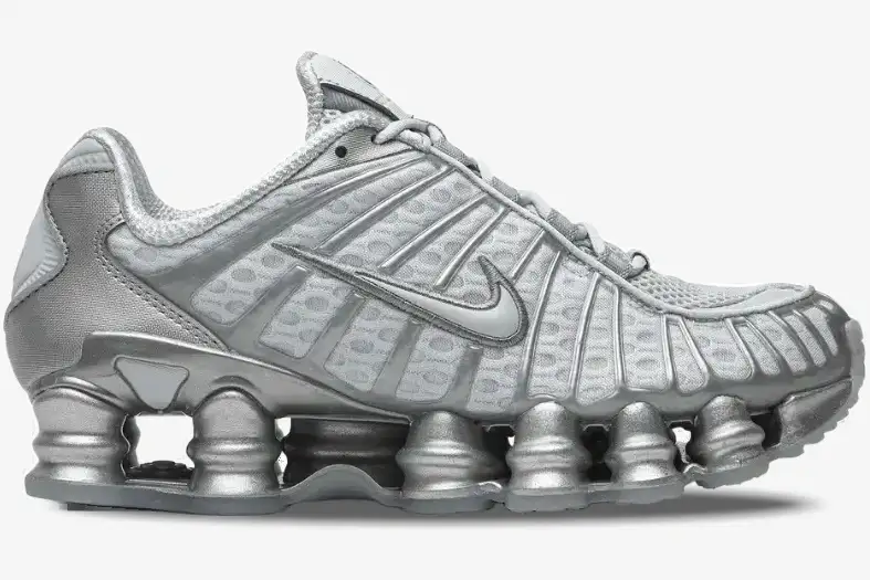 nike-shox-tl-pure-platinum-chrome-side-view-av3595-003 Side view of Nike Shox TL Pure Platinum Chrome sneakers in metallic silver with full-length Shox columns. - SKU AV3595-003
