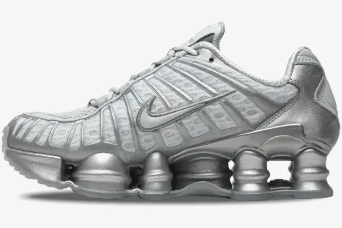 Side profile of Nike Shox TL Pure Platinum Chrome sneakers in metallic silver with full-length Shox columns. - SKU AV3595-003