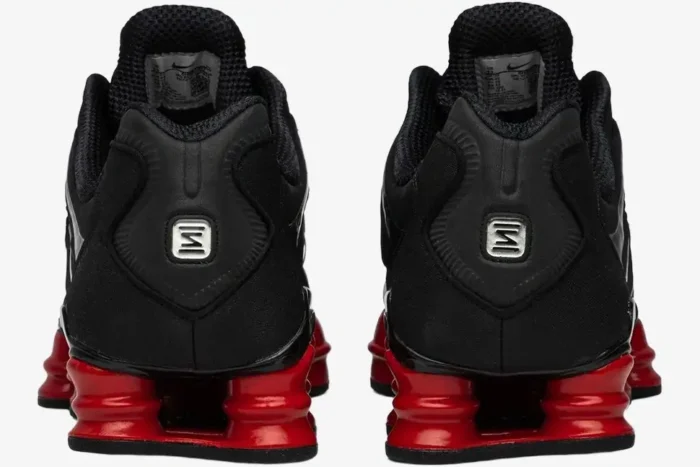 Rear view of Nike Shox TL x Skepta sneakers in black and university red with silver heel logos. - SKU CI0987-001