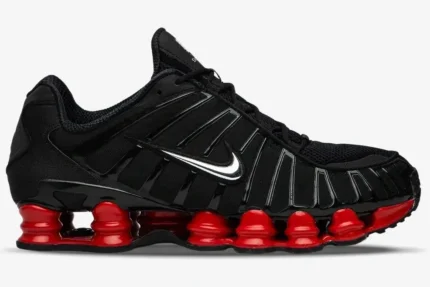 Side profile of a Nike Shox TL x Skepta sneaker in black with metallic silver swoosh and red shox columns. - SKU CI0987-001