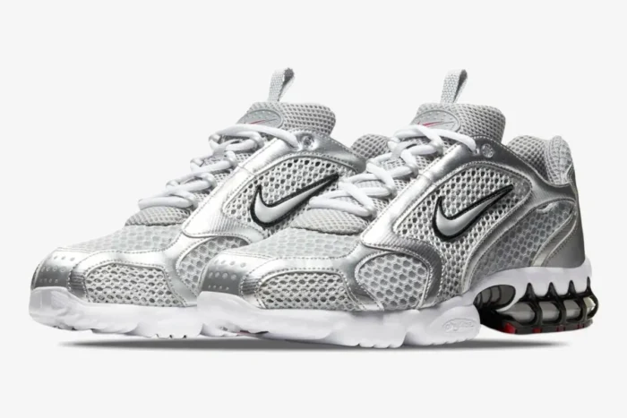 Nike Air Zoom Spiridon Cage 2 in metallic silver, three-quarter front view showing mesh and caged heel. - SKU CJ1288-001