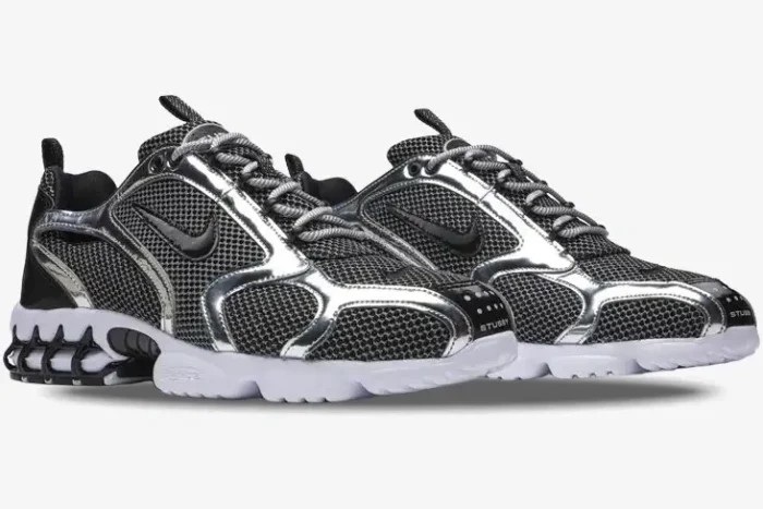Nike x Stussy Air Zoom Spiridon Cage 2 Pure Platinum sneakers, three-quarter view with silver and black mesh. - SKU CU1854-001