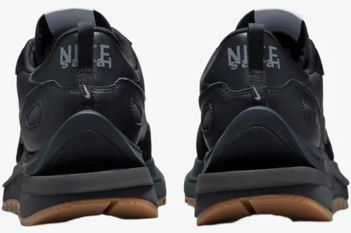 Rear view of Nike VaporWaffle x Sacai Black and Gum sneakers showing layered heel and gum sole. - SKU DD1875-001