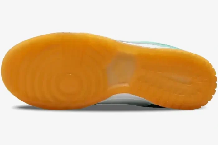 Bottom view of Nike Wmns Dunk Low Teal Zeal showing the translucent gum rubber outsole pattern. - SKU DV2190-100