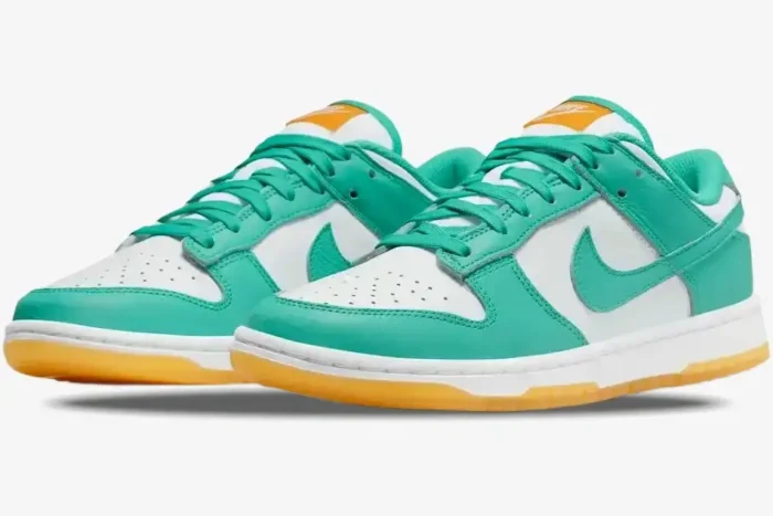 Nike Women's Dunk Low Teal Zeal sneakers in teal and white with gum soles, three-quarter front view. - SKU DV2190-100