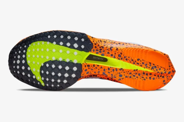 Bottom view of Nike ZoomX Vaporfly 3 Olympic Safari outsole in orange with black spots and lime green details. - SKU FV2324-100