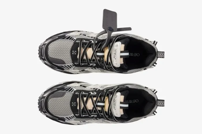 Top-down view of Off-White Be Right Back sneakers in black, white, and grey with a signature zip tie tag. - SKU OMIA295C99FAB0010510