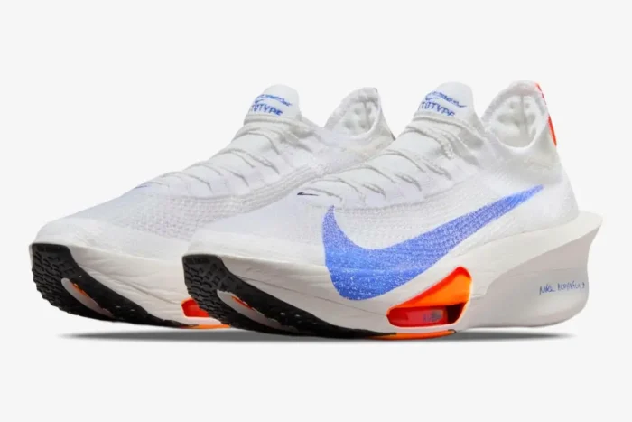 Nike Air Zoom Alphafly Next% 3 running shoes in white with blue swoosh and orange accents, side view. - SKU HF7357-100