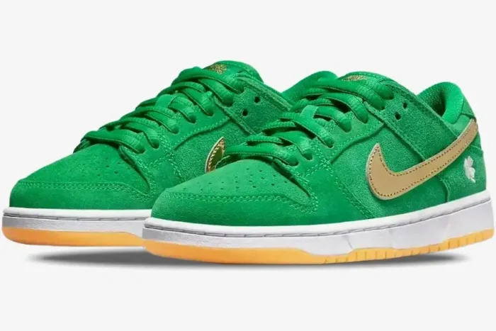 Nike Dunk Low SB St Patrick's Day sneakers in green suede with gold swoosh, three-quarter front view. - SKU BQ6817-303