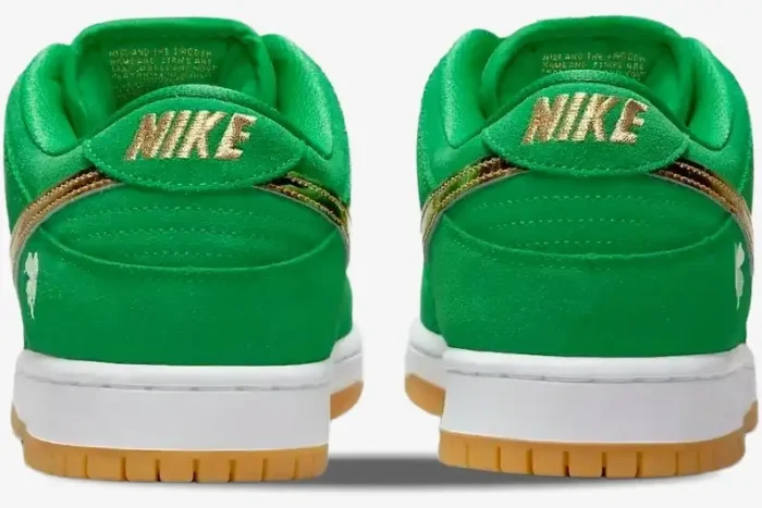 Rear view of green Nike Dunk Low SB St Patrick's Day sneakers with gold Nike logo and gum soles. - SKU BQ6817-303