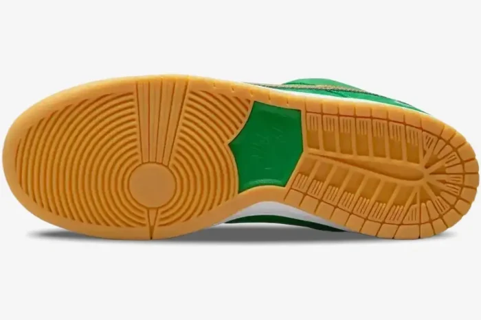 Bottom view of Nike Dunk Low SB St Patrick's Day showing gum rubber outsole and green logo. - SKU BQ6817-303
