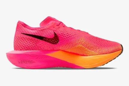 Side profile of a pink and orange Nike ZoomX Vaporfly 3 performance running shoe with a black swoosh. - SKU DV4129-600