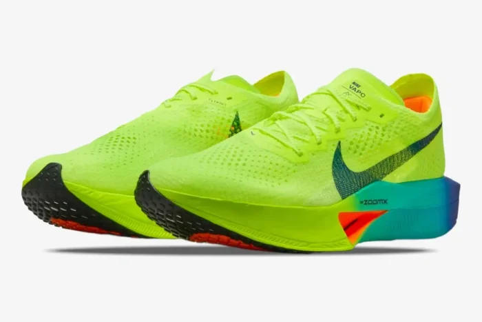 Nike ZoomX Vaporfly 3 marathon racing shoes in volt yellow and blue, three-quarter side view. - SKU DV4129-700