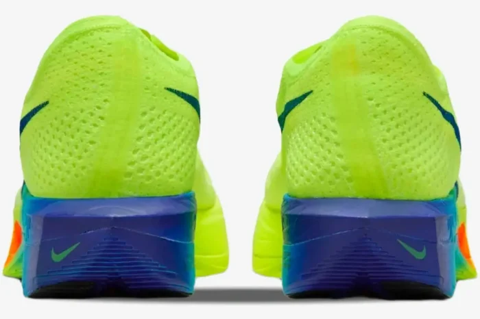 Rear view of Nike ZoomX Vaporfly 3 marathon racing shoes in neon yellow with blue and orange accents. - SKU DV4129-700