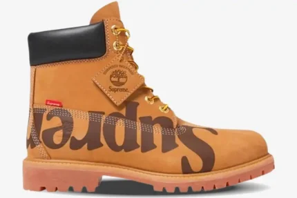 Side profile of a wheat Supreme x Timberland 6-Inch Premium Boot with large brown branding.