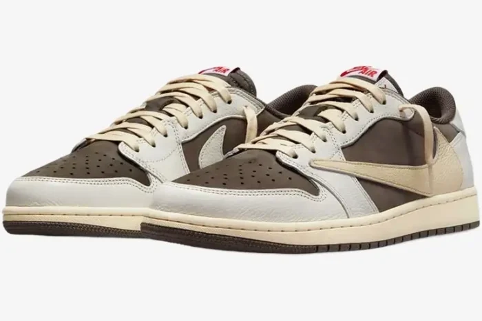Travis Scott x Air Jordan 1 Low Reverse Mocha sneakers in a three-quarter front view with sail and brown panels. - SKU DM7866-162
