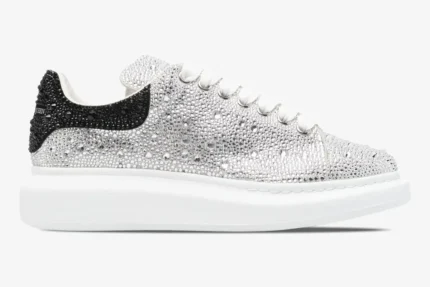 Alexander McQueen Oversized Sneaker with silver crystal embellishments and black heel tab, side view. - SKU 611697WHZ39