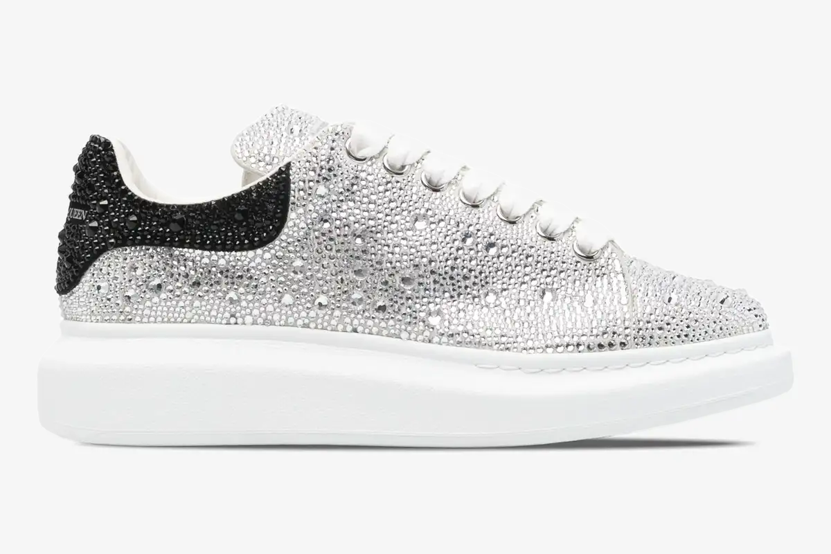 alexander-mcqueen-oversized-sneaker-crystal-side-611697whz39-344-129 Alexander McQueen Oversized Sneaker with silver crystal embellishments and black heel tab, side view. - SKU 611697WHZ39