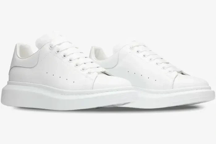Pair of white Alexander McQueen Oversized Sneakers shown from a three-quarter angle. - SKU 553680-WHGP5-9000
