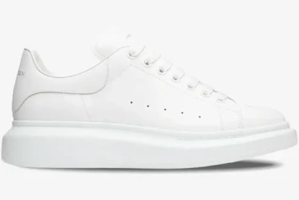 Side profile of an all-white Alexander McQueen Oversized Sneaker with a chunky platform sole. - SKU 553680-WHGP5-9000