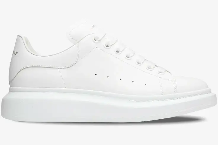 alexander-mcqueen-oversized-sneaker-white-side-553680-whgp5-9000-464-611 Side profile of an all-white Alexander McQueen Oversized Sneaker with a chunky platform sole. - SKU 553680-WHGP5-9000