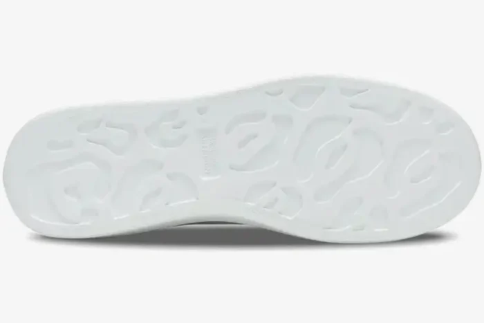Bottom view of the white rubber outsole of an Alexander McQueen Oversized Sneaker with signature leopard pattern. - SKU 553680-WHX92-9123