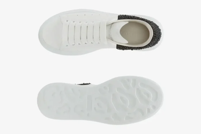 Top and bottom views of white Alexander McQueen oversized sneakers with black glitter. - SKU 666407WIAIJ9581