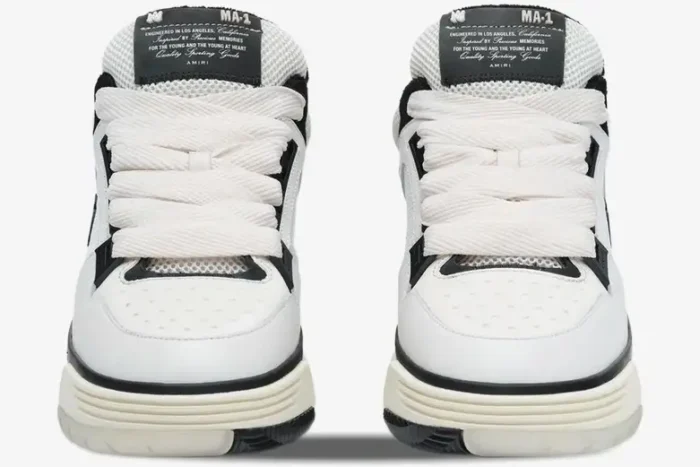 Front view of white and black Amiri MA-1 Nappa luxury skate sneakers featuring oversized chunky laces. - SKU AMFOSR1097-111
