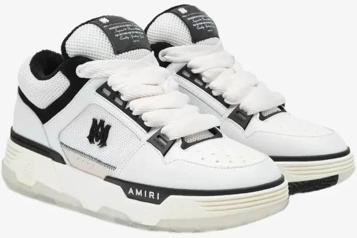 Amiri MA-1 Nappa luxury skate sneakers in white and black, front three-quarter perspective. - SKU AMFOSR1097-111