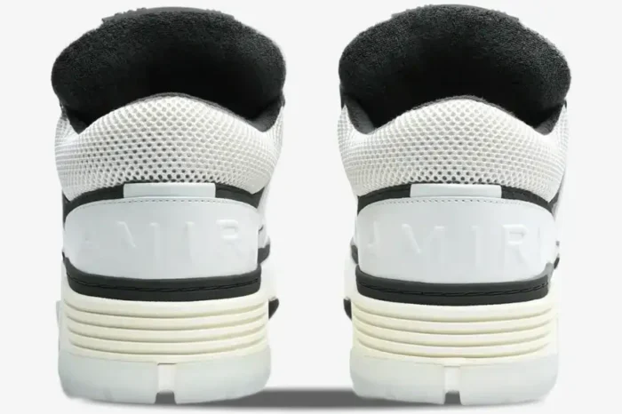 Rear view of white and black Amiri MA-1 Nappa luxury skate sneakers showing embossed heel logos. - SKU AMFOSR1097-111
