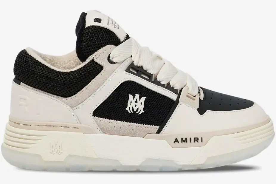 amiri-ma-1-white-black-side-view-pf23mfs010-111-711-587 Amiri MA-1 'White Black' premium sneaker, side profile view showing mesh and leather panels. - SKU PF23MFS010-111