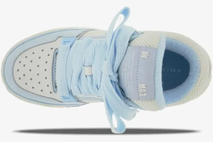 Top-down view of the Amiri MA-1 'White/Blue' luxury skate sneaker with thick blue laces and star perforations. - SKU MFS001-111