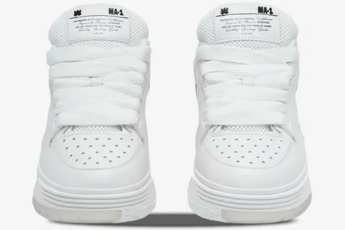 Front view of white Amiri MA-1 luxury skate sneakers with thick laces and star perforations. - SKU AMFOSR1097-100