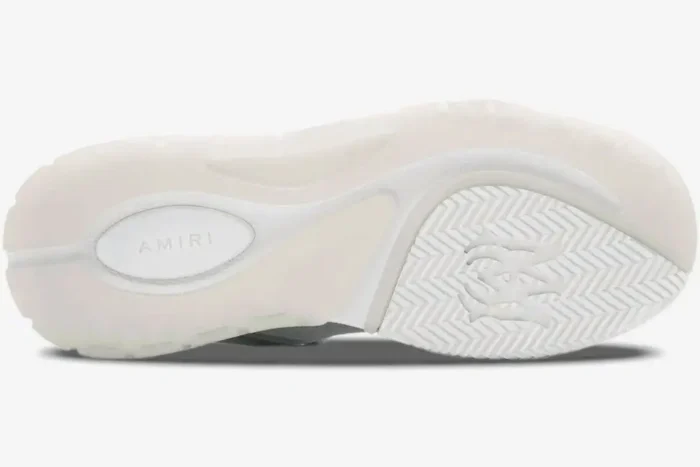 Bottom outsole view of white Amiri MA-1 luxury skate sneaker featuring logo details. - SKU AMFOSR1097-100