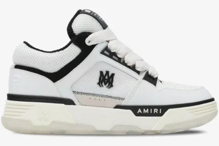 Side profile of an Amiri MA-1 Nappa luxury skate sneaker in white and black with chunky soles and mesh panels. - SKU AMFOSR1097-111